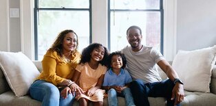 Happy family on couch