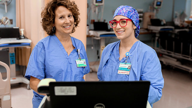Two nurses at a computer